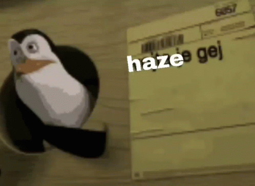 A Penguin Is Standing Next To A Piece Of Paper That Says `` Haze E Gej '' . GIF
