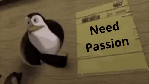 A Penguin Is Standing Next To A Piece Of Paper That Says " Need Passion " GIF