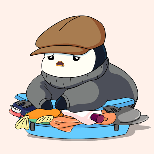 A Penguin Wearing A Hat Sits On Top Of A Suitcase Filled With Clothes GIF