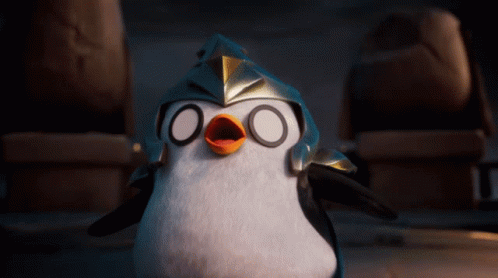 A Penguin Wearing A Helmet With Circles On It 'S Eyes GIF