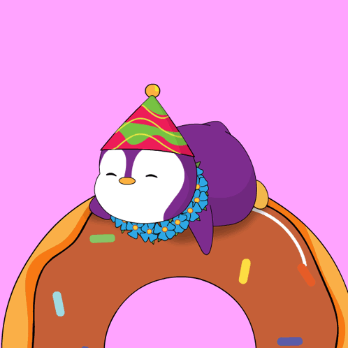A Penguin Wearing A Party Hat Is Laying On Top Of A Doughnut GIF