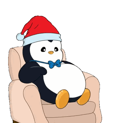 a penguin wearing a santa hat and bow tie is sitting on a chair