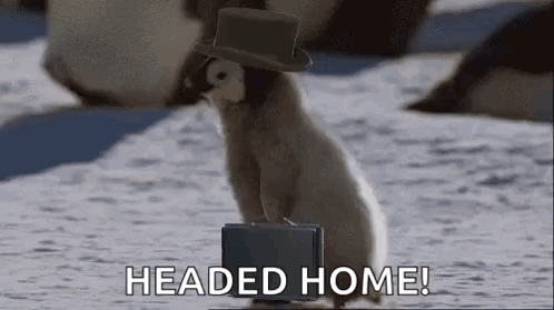 A Penguin Wearing A Top Hat And Carrying A Briefcase Is Standing In The Snow . GIF