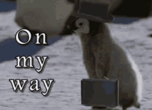 A Penguin Wearing A Top Hat And Tie Is Carrying A Suitcase GIF