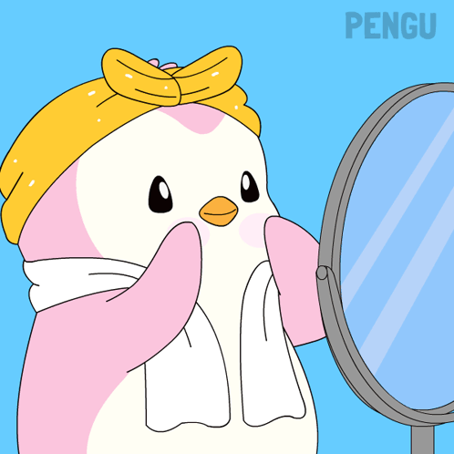 A Penguin With A Towel Around Its Neck Looks In A Mirror GIF