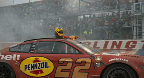 A Pennzoil Race Car With The Number 22 GIF