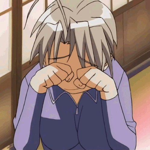 A Person Covering Their Face With Their Hands GIF