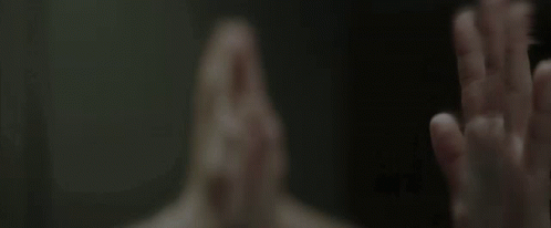 A Person Covering Their Face With Their Hands GIF