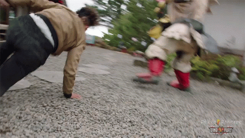 A Person Doing Push Ups With The Word Power Rangers On The Bottom GIF