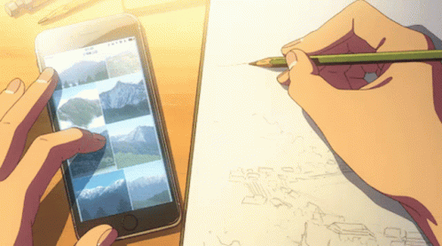 A Person Drawing On A Piece Of Paper While Looking At A Cell Phone GIF