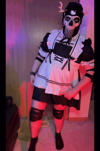 A Person Dressed In A Maid Outfit With A Hello Kitty Hat GIF