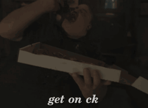 A Person Holding A Box That Says " Get On Ck " On It GIF
