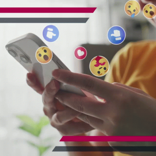 A Person Holding A Cell Phone With Emojis Floating Around GIF