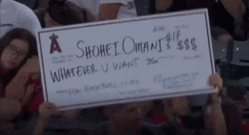 A Person Holding A Check That Says A Shohei Omani Whatever U Want GIF