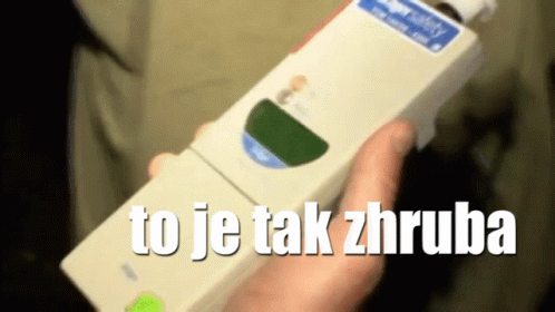 A Person Holding A Device That Says To Je Tak Zhruba On It GIF