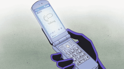 A Person Holding A Flip Phone That Says Talking On It GIF