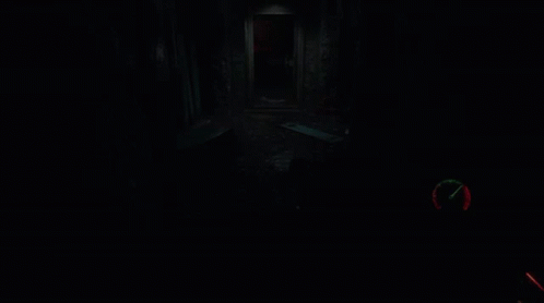 A Person Holding A Gun In A Dark Room With A Clock On It GIF