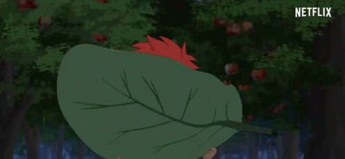 A Person Holding A Large Green Leaf In Front Of Their Face With Netflix Written In The Corner GIF