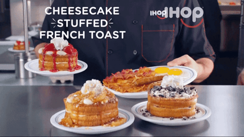 A Person Holding A Plate Of Cheesecake Stuffed French Toast On A Counter GIF