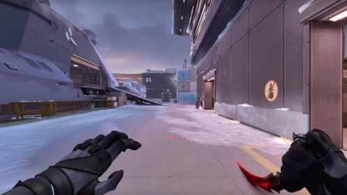 A Person Holding A Red Knife In Front Of A Building With The Number 01 GIF