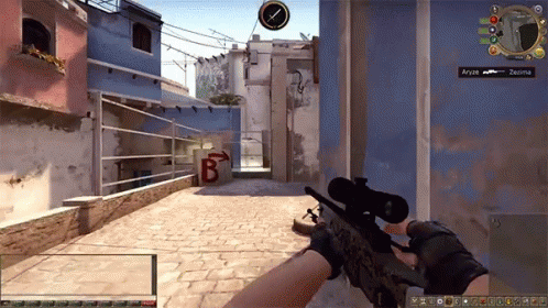 A Person Holding A Sniper Rifle In A Video Game With The Letters B On The Wall Behind Them GIF