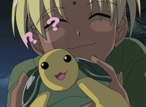 A Person Holding A Stuffed Animal With A Question Mark On Their Head GIF