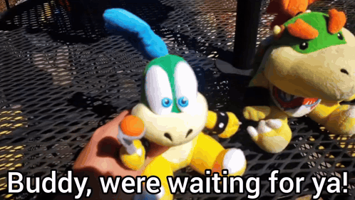 A Person Holding A Stuffed Animal With The Words " Buddy Were Waiting For Ya " Below It GIF