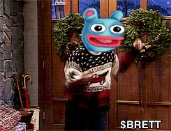 A Person Holding A Wreath In Front Of A Door With The Name Brett On The Bottom GIF