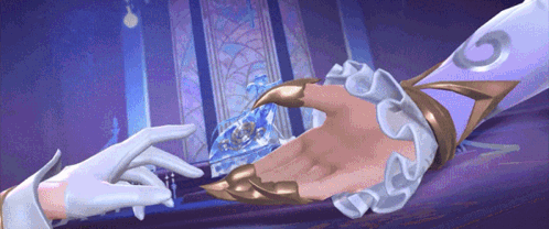 a person holding another person 's hand with the letter g on it