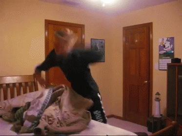 A Person In A Bedroom With A Calendar On The Wall GIF