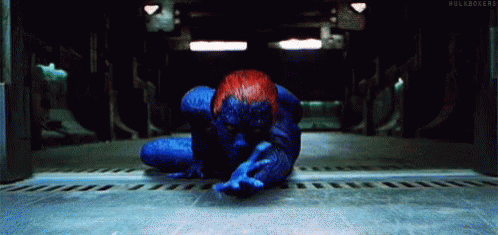 A Person In A Blue And Red Superhero Costume Is Laying On The Floor . GIF