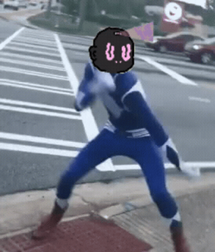 A Person In A Blue And White Superhero Costume With A Black Head With The Letter U.v. On It GIF