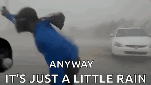 A Person In A Blue Jacket Is Jumping In The Air With The Words Anyway It 'S Just A Little Rain Written Below Them GIF