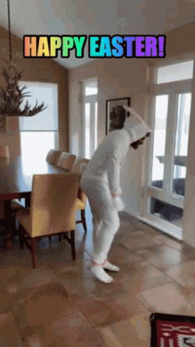 A Person In A Bunny Costume Is Dancing In A Living Room With The Words Happy Easter Written On It GIF