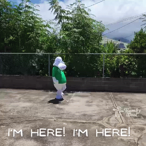 A Person In A Bunny Costume Is Standing In A Parking Lot And Says I 'M Here GIF