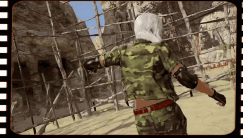 A Person In A Camouflage Uniform Is Standing In Front Of A Sign That Says ' A.m.p. ' GIF