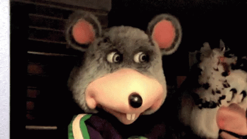 A Person In A Chuck E Cheese Mouse Costume GIF