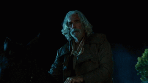 A Person In A Cowboy Hat Is Surrounded By Fire GIF