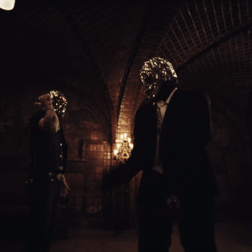 A Person In A Dark Room With A Mask On GIF