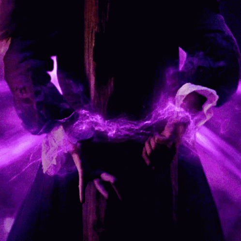 A Person In A Dark Room With Purple Lights Coming Out Of Their Hands GIF
