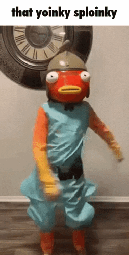 A Person In A Fish Costume Is Dancing In Front Of A Clock That Says That Yoinky Sploinky GIF