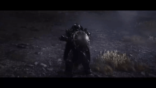 A Person In A Helmet Is Standing In The Dark In A Field . GIF