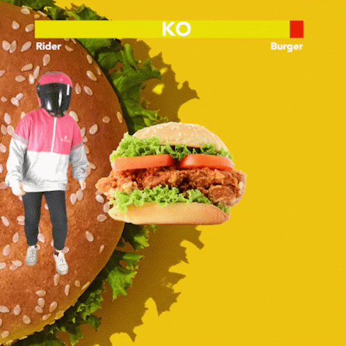 A Person In A Helmet Is Standing Next To A Large Hamburger That Says Rider GIF