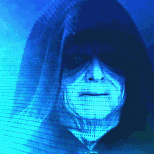 A Person In A Hooded Jacket With A Blue Background Behind Them GIF