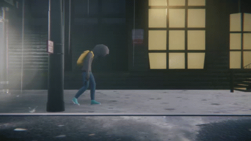 A Person In A Hoodie Is Walking Down A Street GIF
