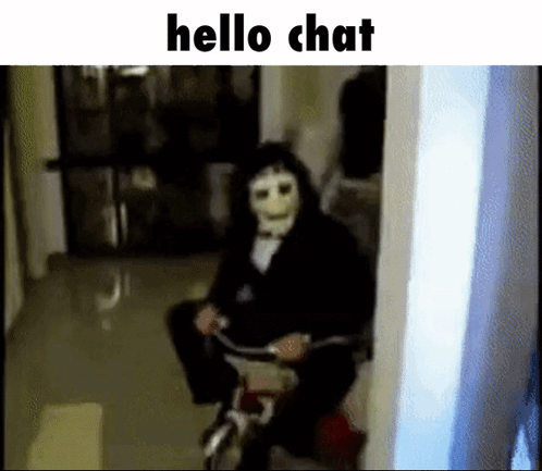A Person In A Mask Is Riding A Bicycle In A Hallway . GIF