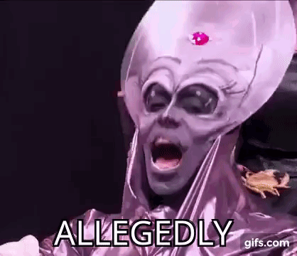 A Person In A Purple Alien Costume Is Making A Funny Face . GIF