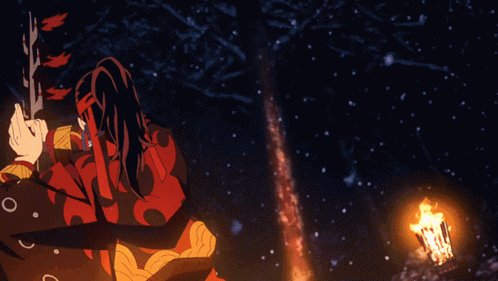 A Person In A Red And Black Outfit With Chinese Writing On Their Face Is Standing In The Snow GIF