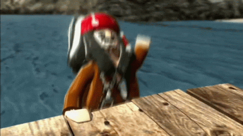 A Person In A Red Helmet Is Standing On A Wooden Dock Near The Water GIF