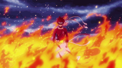 A Person In A Red Shirt Is Standing In A Field Of Fire GIF